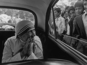 INDIA. State of Assam. Town of Shillom. Mother TERESA being greeted during a visit to one of her missions. 1989.
