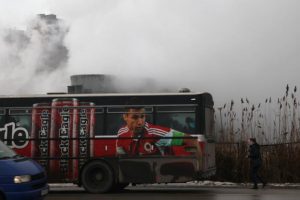 A bus passes by coal-fired power plants in Obilic, north of capital Pristina, Kosovo, February 2, 2017. Picture taken February 2, 2017. REUTERS/Hazir Reka